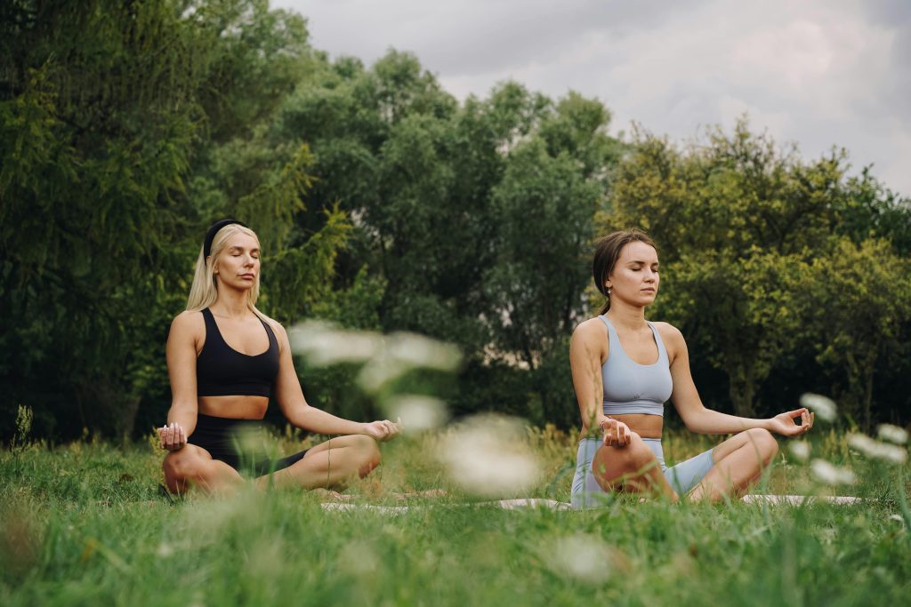 Photo by olia danilevich woman-in- black-tank-top-sitting-on-green-grass-field
